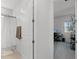 Bathroom with shower/tub and a view into a room with an office setup at 2223 Blue Salvia St, Clermont, FL 34711