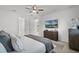 Bright bedroom with a ceiling fan, TV, and a neutral color palette for a serene and inviting atmosphere at 2223 Blue Salvia St, Clermont, FL 34711