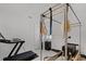 Bright exercise room with exercise equipment and natural light coming in through the window at 2223 Blue Salvia St, Clermont, FL 34711