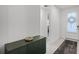 Foyer showcasing modern green cabinet with decorative bowl, tiled floors and a rug at 2223 Blue Salvia St, Clermont, FL 34711