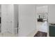 Bright hallway with tile flooring leading to an open-concept living area, showcasing a seamless flow and modern design at 2223 Blue Salvia St, Clermont, FL 34711