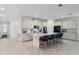 A spacious kitchen featuring a large island with seating, modern appliances, and ample cabinet space at 2223 Blue Salvia St, Clermont, FL 34711