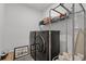 Laundry room with new front load washer and dryer and custom storage shelving at 2223 Blue Salvia St, Clermont, FL 34711