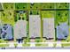 Aerial view of the property highlighting the roof, landscaping, and surrounding neighborhood at 2223 Blue Salvia St, Clermont, FL 34711