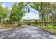Picturesque view of the community clubhouse surrounded by lush landscaping at 242 Peppertree Ct, Lake Mary, FL 32746