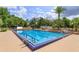 Large community pool with clear blue water and surrounding lounge area at 242 Peppertree Ct, Lake Mary, FL 32746