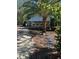 Charming single-story home featuring a quaint porch, awning-covered windows, and a lush, well-maintained front yard at 242 Peppertree Ct, Lake Mary, FL 32746