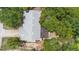 An aerial view showcasing the property's roof and mature trees at 244 Angeles Rd, Debary, FL 32713