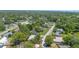 An aerial perspective of a neighborhood with well-maintained homes and lush greenery, creating a serene atmosphere at 244 Angeles Rd, Debary, FL 32713