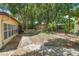 Spacious backyard featuring lush landscaping, a shed, and patio area at 244 Angeles Rd, Debary, FL 32713