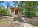 Charming view of the home exterior with lush landscaping at 244 Angeles Rd, Debary, FL 32713
