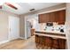Functional kitchen area with breakfast bar, wood-look flooring, and convenient layout at 244 Angeles Rd, Debary, FL 32713