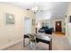 Bright living room features neutral walls, carpeted floors, comfortable seating and ample natural light at 244 Angeles Rd, Debary, FL 32713