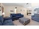 Inviting living room featuring vaulted ceilings, comfortable seating, and stylish decor at 244 Angeles Rd, Debary, FL 32713