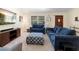 Comfortable living room with a large window, stylish seating, and decor at 244 Angeles Rd, Debary, FL 32713