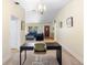 Inviting living room with carpeted floors, cozy furniture, and bright natural light streaming through the windows at 244 Angeles Rd, Debary, FL 32713