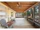 Covered patio with seating offers a relaxing outdoor space for leisure at 244 Angeles Rd, Debary, FL 32713