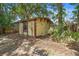 Outdoor backyard shed with a secure door and window for storage at 244 Angeles Rd, Debary, FL 32713