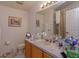 Bathroom with a single sink vanity, and framed mirrors at 244 Ballyshannon Dr, Davenport, FL 33897