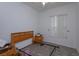 Empty bedroom with hardwood floors, a headboard and dresser at 244 Ballyshannon Dr, Davenport, FL 33897