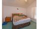 Cozy bedroom with an RC logo, light wood headboard, and carpeted flooring at 244 Ballyshannon Dr, Davenport, FL 33897