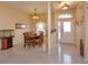 Bright dining area featuring tile floors, chandelier, and natural light from the front door at 244 Ballyshannon Dr, Davenport, FL 33897