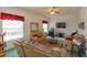 Bright living room with large window, comfortable couches and accent carpet at 244 Ballyshannon Dr, Davenport, FL 33897