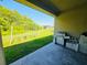 Spacious backyard featuring covered patio, swing set and grill at 2456 Varenna Loop, Kissimmee, FL 34741