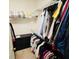 Walk-in closet with ample storage space, shelving, and rods for organized clothing at 2456 Varenna Loop, Kissimmee, FL 34741