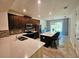 Spacious kitchen boasting stainless appliances and an island with barstool seating at 2456 Varenna Loop, Kissimmee, FL 34741