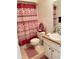 Bathroom with decorative shower curtain, toilet, and vanity with a well-lit mirror at 2514 Citrus Club Ln # 308, Orlando, FL 32839