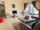 Bright living room with a sliding door to the outdoors, modern furnishings, and tiled floors at 2514 Citrus Club Ln # 308, Orlando, FL 32839