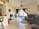 Bright living room with tiled floors, sliding door access, ceiling fan, and modern furniture at 2514 Citrus Club Ln # 308, Orlando, FL 32839
