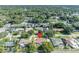 A bird's eye view of a beautiful home in a serene neighborhood with lush greenery and a sparkling pool at 2524 Sweetwater Trl, Winter Park, FL 32789