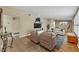 Bright living room with tile flooring, stylish furnishings, and modern decor, ideal for relaxing or entertaining at 2524 Sweetwater Trl, Winter Park, FL 32789