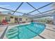 Backyard pool featuring turquoise water, patio, lounge chairs, and screened enclosure at 2524 Sweetwater Trl, Winter Park, FL 32789