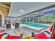Relaxing screened pool with patio furniture and chairs for enjoying outdoor living and entertaining at 2524 Sweetwater Trl, Winter Park, FL 32789
