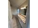Bathroom featuring double sinks, granite countertops, and tub at 300 Churchill Dr, Longwood, FL 32779