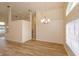 Open dining room with neutral walls, laminate flooring, modern lighting and open floor plan at 300 Churchill Dr, Longwood, FL 32779