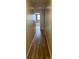 Hallway featuring hard-surface flooring and bath at the end at 300 Churchill Dr, Longwood, FL 32779