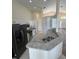 Bright kitchen with granite countertops, stainless appliances, and ample cabinet space at 300 Churchill Dr, Longwood, FL 32779