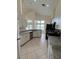 Well-lit kitchen offers granite countertops, white cabinets, and stainless steel appliances at 300 Churchill Dr, Longwood, FL 32779