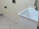A laundry room features a deep utility sink for added functionality and convenience at 300 Churchill Dr, Longwood, FL 32779