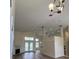Open-concept living space with fireplace, high ceilings, and access to the backyard at 300 Churchill Dr, Longwood, FL 32779