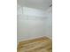Walk-in closet with wood floors, wire rack shelving, and white walls at 300 Churchill Dr, Longwood, FL 32779