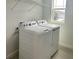 Convenient laundry room equipped with a washer and dryer at 3087 Sunset Hills Rd, Winter Haven, FL 33881