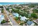 Aerial view of multiple homes with palm trees and a view of the ocean and buildings in the distance at 330 Phoenix Ave, Daytona Beach, FL 32118