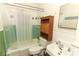 Functional bathroom with a shower-tub combo and storage with a vanity at 330 Phoenix Ave, Daytona Beach, FL 32118