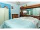 Bedroom features a blue bed, a dresser and mirrored closet at 330 Phoenix Ave, Daytona Beach, FL 32118