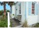 Inviting exterior detail showcasing a bench on the porch and charming architectural elements at 330 Phoenix Ave, Daytona Beach, FL 32118
